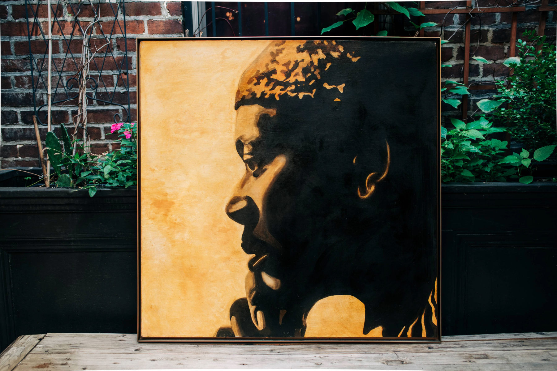 Oil portrait of Randy Weston in gold and amber